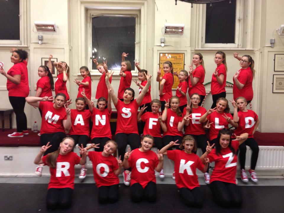 Razzamataz Theatre Schools Mansfield students posing in costume back stage at Her Majesty's Theatre in London's West End