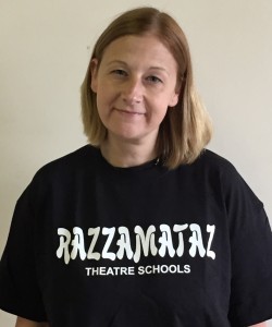 Razzamataz Theatre Schools Liverpool Principal Lyndsey Winstanley standing against white background in Razzamataz t-shirt 