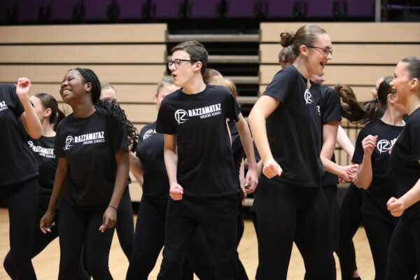 Students taking part in a dance class having fun